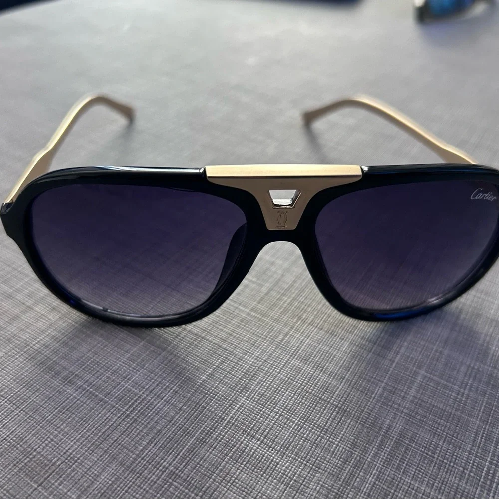 Cartier Black Frame Sunglasses with Purple Gradient Lenses and Gold Accent